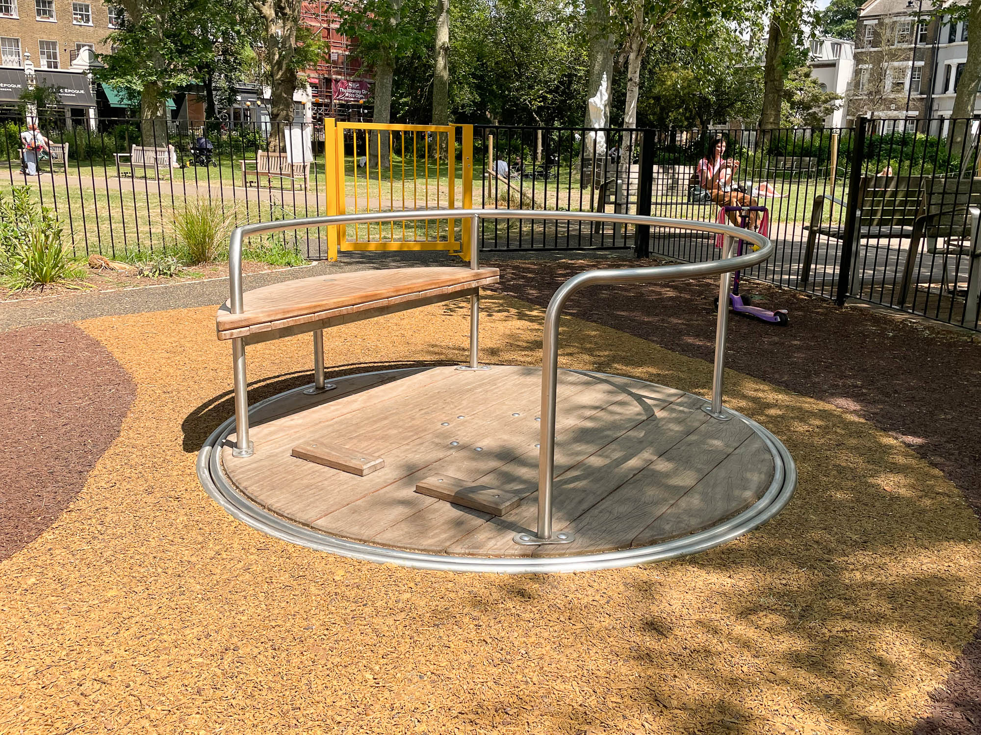 natural playground equipment accessible roundabout